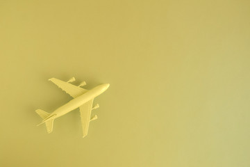 High angle view of model commercial plane yellow color concept.