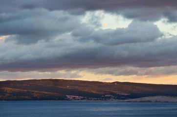 Dark clouds at sunset over a landscape on the coast of Croatia