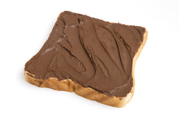 slice of bread with cocoa cream on white background