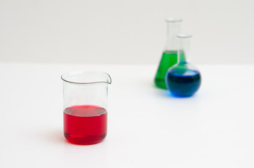 Chemistry glasses filled with colorful liquids