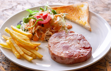 Ham steak and vegetable salad