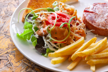 Vegetable salad and ham steak