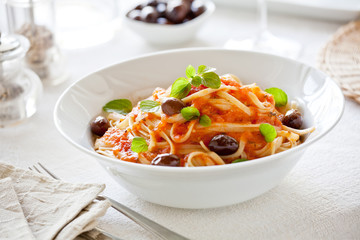 Bowl Of Pasta With Organic Tomato Sauce And Olives