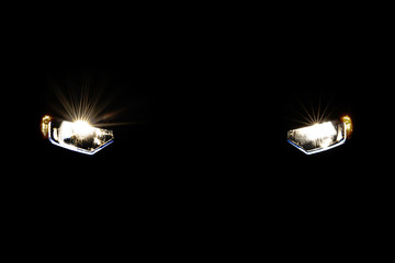 Headlight car in dark background