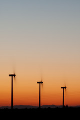Fototapeta na wymiar wind turbines at sunset, wind energy
