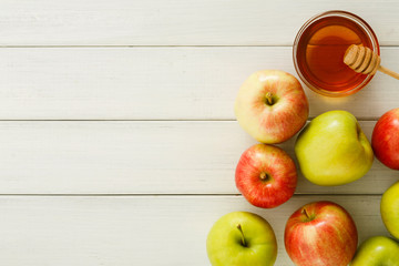 Seasonal harvest background with apples and honey