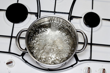 casserole with boiling water on the stove