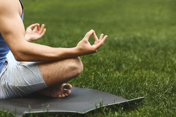 Young man practicing yoga, relax meditation pose