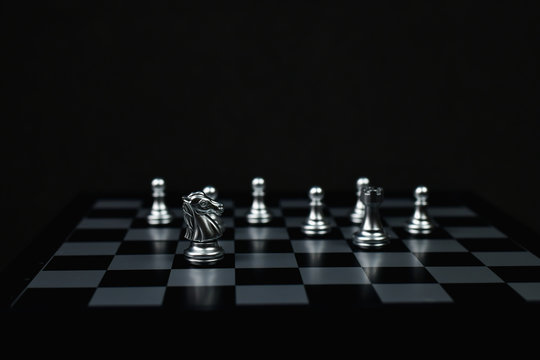 Leadership Concepts, Chess is a leader, Chess game on a black background.