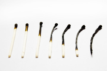 burnt matches on white background