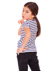 Obraz premium Little girl has put forefinger to lips as sign of silence