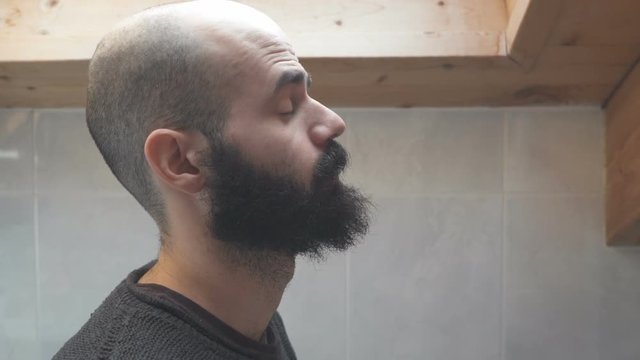 Man Face in Profile Peeing