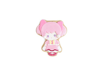 Cute cookie isolated on a white background. Gingerbread with sugar glazed of a little girl in pink with pigtails, very cute Japanese style lolita dress.