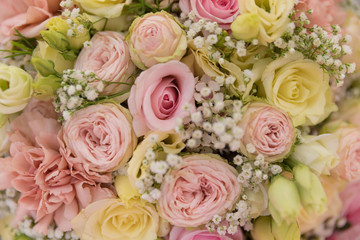 Obraz na płótnie Canvas A beautiful wedding bouquet made of roses is a detectable shot that can be used as a background