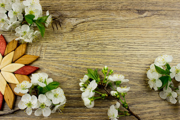 Fototapeta na wymiar Kitchen equipment concept. White flowers. Wooden texture. Empty space for text