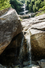 Descent; cascade waterfall on the wall of the Valle Versasca in Ticino