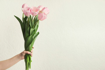 Bouqet of pink tulips on black background, top view