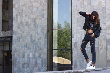 Girl street style urban hipster in the geometric city scene