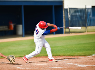 Baseball player swinging at the ball