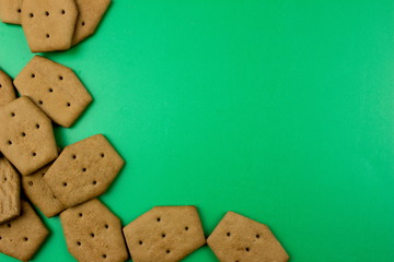 Chocolate Сookies and snacks. Food concept. Empty space for text and design. Green texture