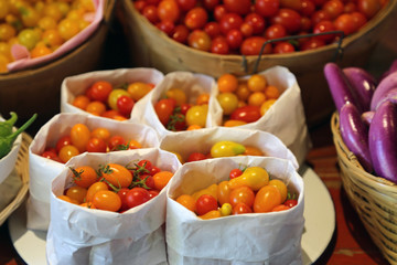 Fototapeta na wymiar Cherry tomatoes for sale at a farmers market
