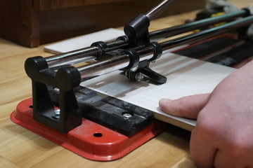 Cutting ceramic tile hand tile cutter