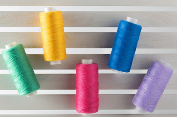 Color sewing thread used  in fabric and textile industry yellow blue red green