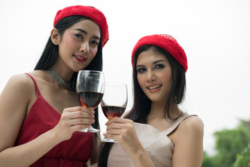 Young people holding glass talk in the party.