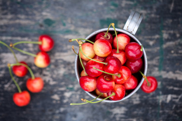 juicy cherry in an old mug, top view