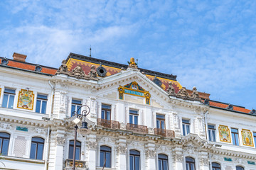 Facade of the County Hall decorated with colorful ornaments made of ceramics in Pecs, Hungary. 