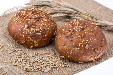 Round whole-wheat rye rolls with flax and sunflower seeds