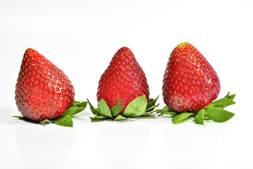 Ripe strawberry close up isolated on a white background