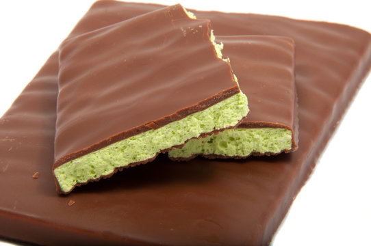 Milk chocolate with mint filling isolated on the white