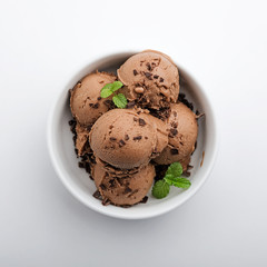 Chocolate ice cream on white wooden background. top view.