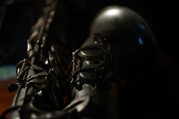 close-up of a old saxophone in the dark