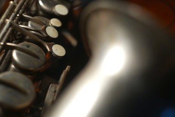 close-up of a old saxophone in the dark