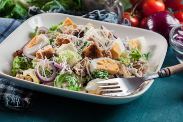 Healthy caesar salad with cheese, eggs and croutons