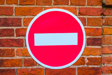 road sign on a brick wall background