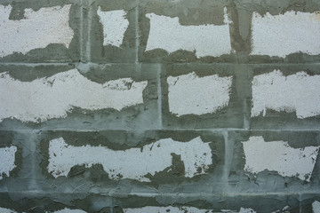 Gray wall of foam blocks on glutinous solution
