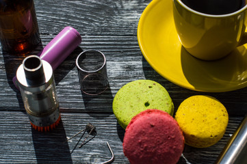 Still life with e-cig and jiuce on the wooden background
