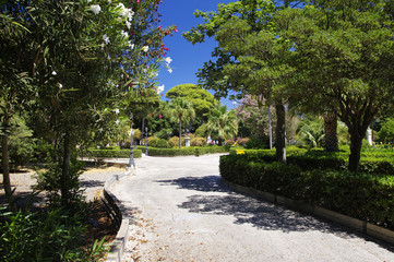 TRAPANI, ITALY - AUGUST 08th, 2017:Deserted main park in the center of Trapani in the high noon on August 8, 2017, Sicily, Italy