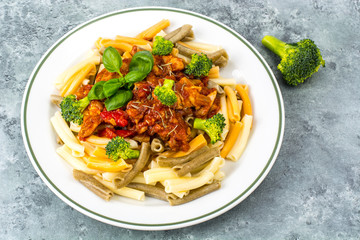 Pasta with chicken fillet, tomatoes, sweet pepper