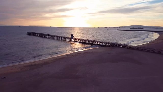 Seal Beach Coast Sunset pier pan right to left LA California