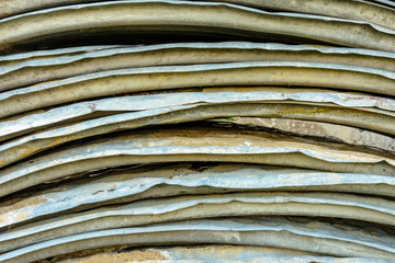 Beautiful textured background of metal oval sheets for roofing