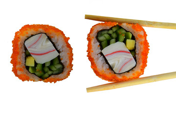 Sushi a dish of the traditional Japanese cuisine cooked from rice, caviar of a salmon and vegetables. The object isolated on a white background. Close up. Wooden sticks hold sushi