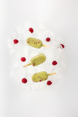 Matcha Popsicles with Raspberries on Ice Cubes