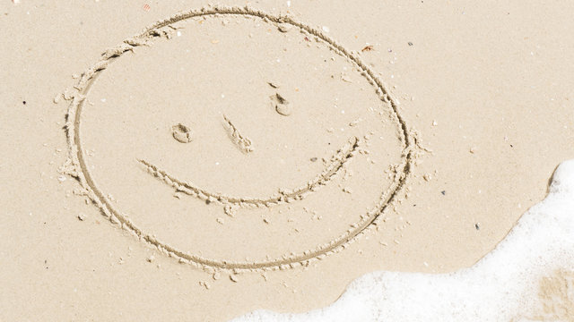 face of a funny man on the sand