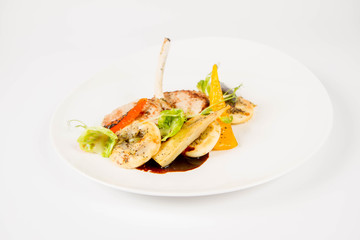 Meat dish with vegetables on a white background