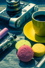 Still life with e-cig and jiuce on the wooden background