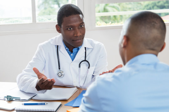 African american doctor explaining diagnosis to patient